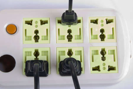 Connected electric outlet on white background