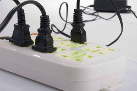 Connected electric outlet on white background