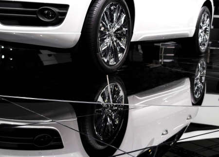 Car and its reflection in darkの写真素材