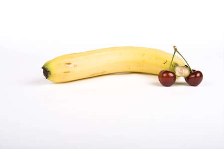 Cherrys and banana isolated on white backgroundの写真素材