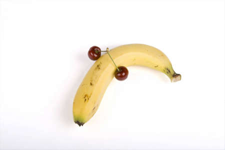 Cherrys and banana isolated on white backgroundの写真素材