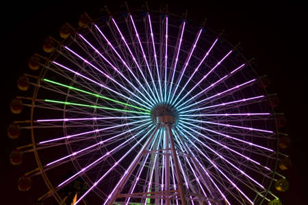 Ferris wheel at night in an amusement park の写真素材