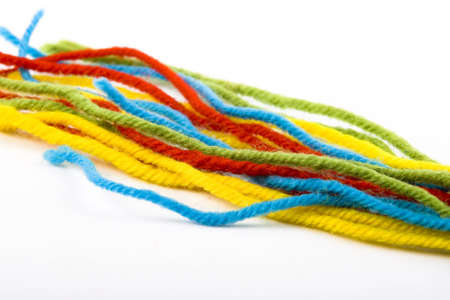 the colorful wool threads on the whiteの写真素材