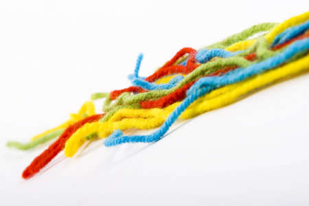 the colorful wool threads on the whiteの写真素材