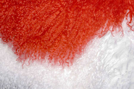 red and white fur texture to backgroundの写真素材