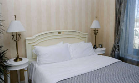 luxury interior of bedroom with large bed
