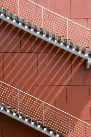 The red wall has rises the stairsの写真素材