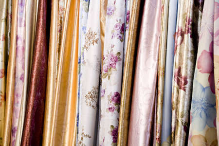 Bolts of colorful fabric in a market