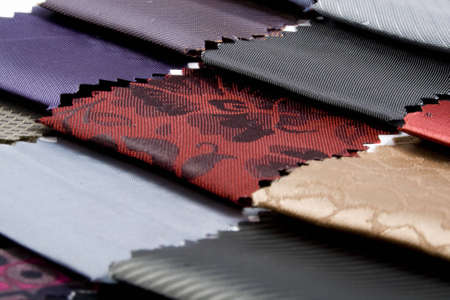 Has the colorful textiles swatches and samples background