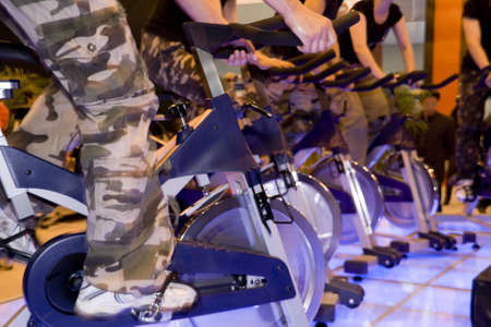 group of peoples doing spinning in a gym