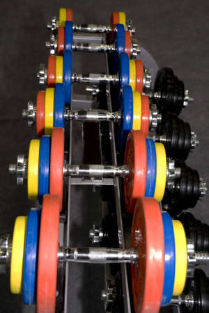 Closeup of colorful dumbbells in a gym or studioの写真素材