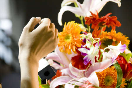 a woman hand and flower basketの写真素材