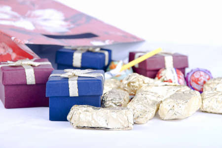 Christmas gift bag  opened with gifts and candiesの写真素材