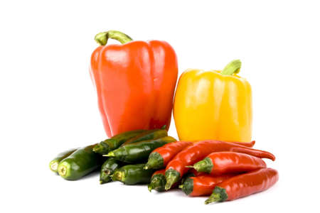 Red and green chili peppers on white background 
