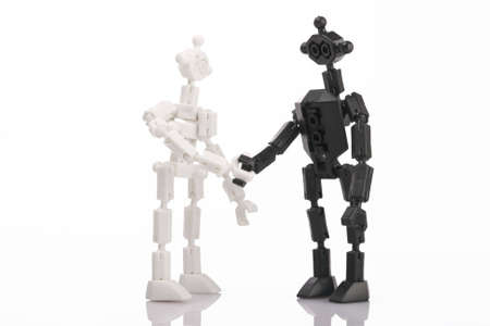 toy bricks people handshake on white backgroundの写真素材