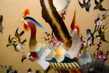 Colorful embroidery of bird in chinaの写真素材