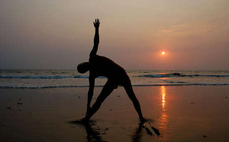 yoga men water nature liquid sky sea wave healthy relaxation idyllic healthcare lifestyle summer beach spring life sunset sand landscape light health resort non-urban sunlight single panoramic goodness clouds paradise male one human happiness standing posの写真素材