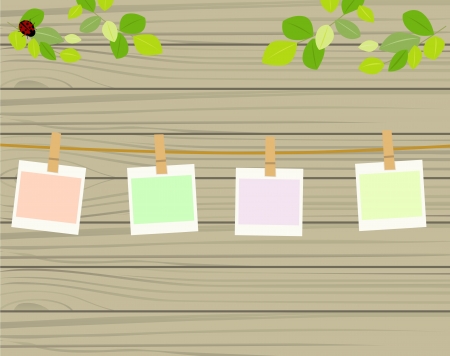 Four photos hanging on rope のイラスト素材