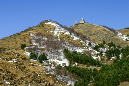 Looking up at the Gergeti Trinity Church on the hill from Stepantsminda town
