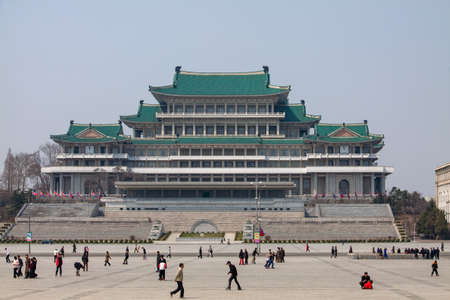 Pyongyang, North Korea - Apr 16, 2010: People who enjoy roller skating in the Kim Il-sung Square, with the Grand People's Study Houseのeditorial素材
