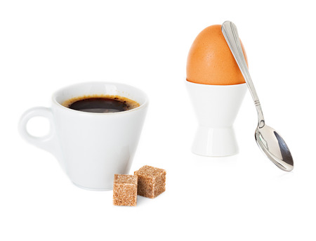cup of coffee and boiled Brown egg in cup