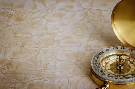 Compass on vintage old paper background