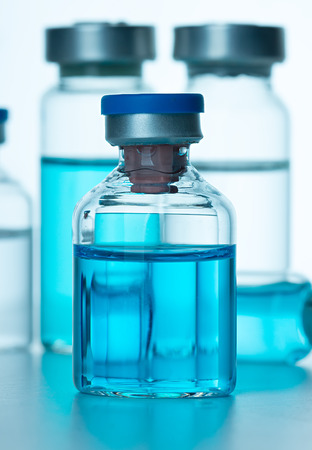 Vials of the vaccine, blue backgroundの写真素材