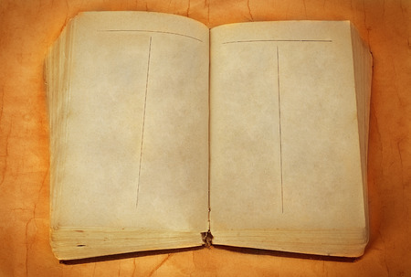 Old grunge book close-up on a vintage background.の写真素材