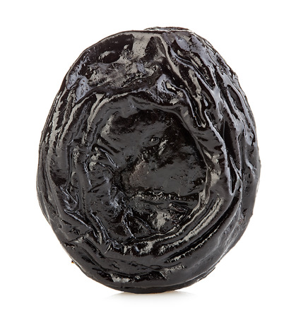 Raw organic prunes, dried plums, smoked prunes close-up on a white background.の写真素材