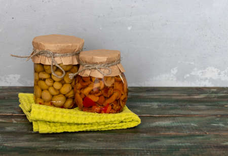 homemade pickled mushrooms in a glass jar. Canned mushrooms close-up, organic homemade pickles with copy spaceの写真素材