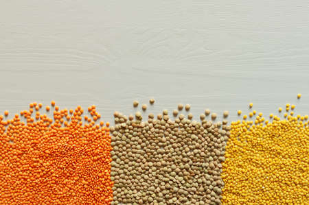 Dried red, yellow, green Split Lentils background. Nutritious and Important Protein Source. Flat lay, texture, Copy spaceの写真素材