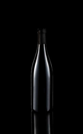 bottle of wine on black background with reflectionの写真素材