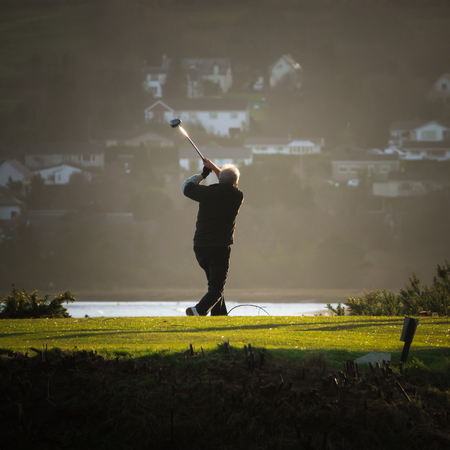 A Senior Plays Golf In Scotland