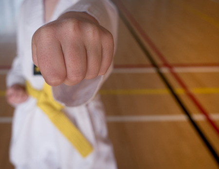 Child Punches During Sport of Taekwondo Practiseの写真素材
