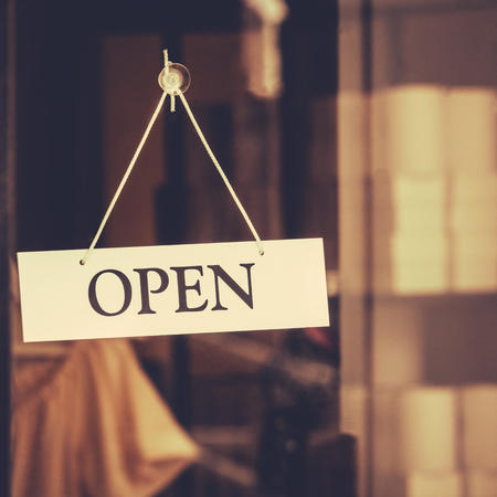 Retro Style Open Sign in Store Window With Copy Spaceの写真素材