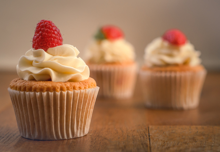 Freshly Baked Rasberry Vanilla Cupcakesの写真素材
