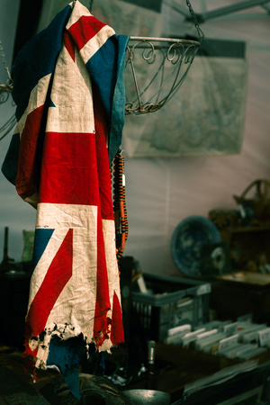 Damaged Old UK Flag For Sale in a Second Hand Shopの写真素材