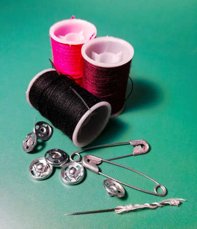 Threads and pins on the tableの写真素材