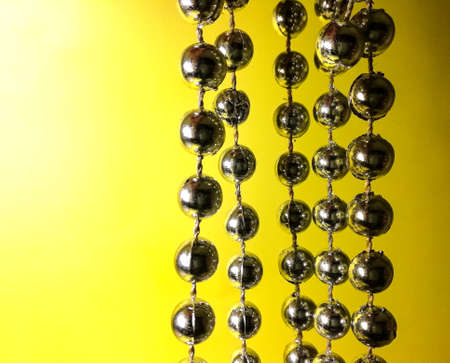 silver balls on a yellow backgroundの写真素材