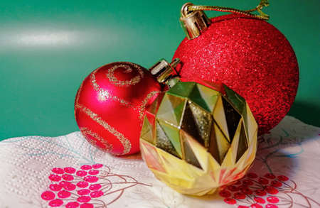 colorful Christmas toys on a green backgroundの写真素材