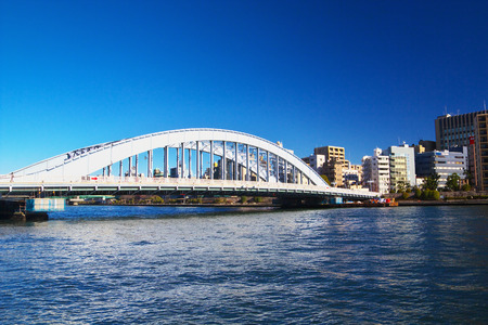 TOKYO-JAN 12: View of Eitai Bridge with the city of Koto area on Jan 12, 2015 in Tokyo, Japan. The bridge has been designated as a national important cultural property in 2007.のeditorial素材