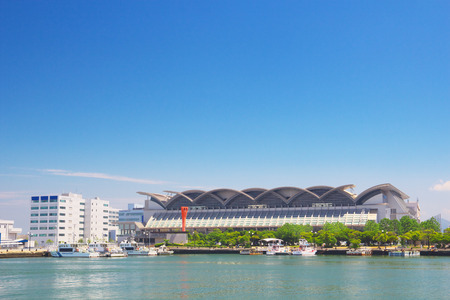 FUKUOKA, JAPAN-JUL 09: View of Hakata Port with Marine Messe Fukuoka on Jul 09, 2015 in Fukuoka, Japan. Marine Messe Fukuoka is arena facility that is used for many events and concerts.のeditorial素材