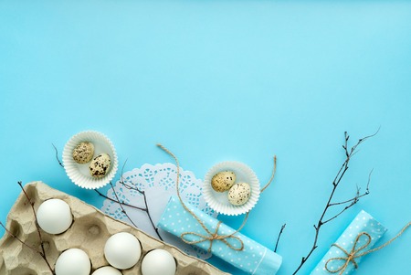 easter composition on blue background with free and copy space