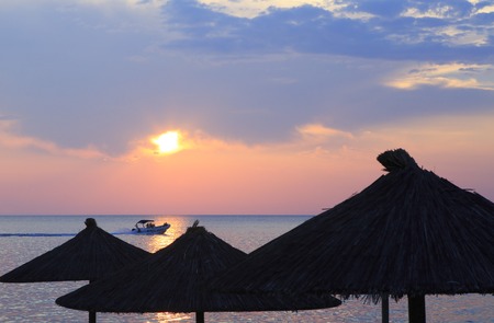 Boat in the sea and sunset. Porto Carras. Sithonia.の写真素材