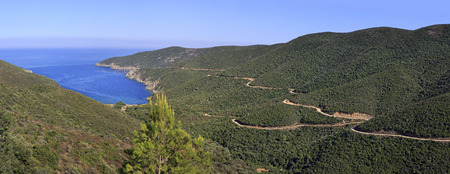 Beautiful panorama of winding mountain road to the bay. Sithonia peninsula. Greece.の写真素材