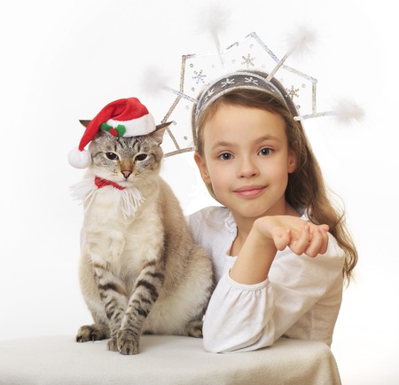 Beautiful Snow Maiden with a funny Santa Claus.の写真素材