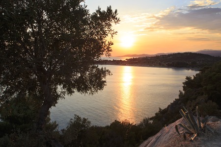 Picturesque sunset in the Bay of the Aegean Sea. Sithonia peninsula. Greece.の写真素材