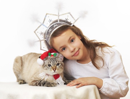 Beautiful Snow Maiden with a funny Santa Claus.の写真素材