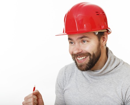 Joyful builder in red helmet on white background.の写真素材