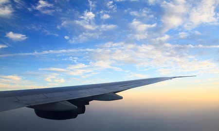 Wing aircraft at sunset over the Gulf. UAE.の写真素材